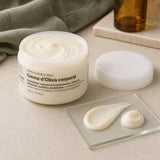 Crema Corporal Oliva 250 ml. Detalle de apertura y textura del producto.