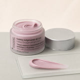 Crema Oxigenante Loto 50 ml. Detalle de apertura y textura del producto.